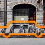 A bicycle parking, with a decoration shaped like a car, on a roadside in centeal Malmö, Sweden