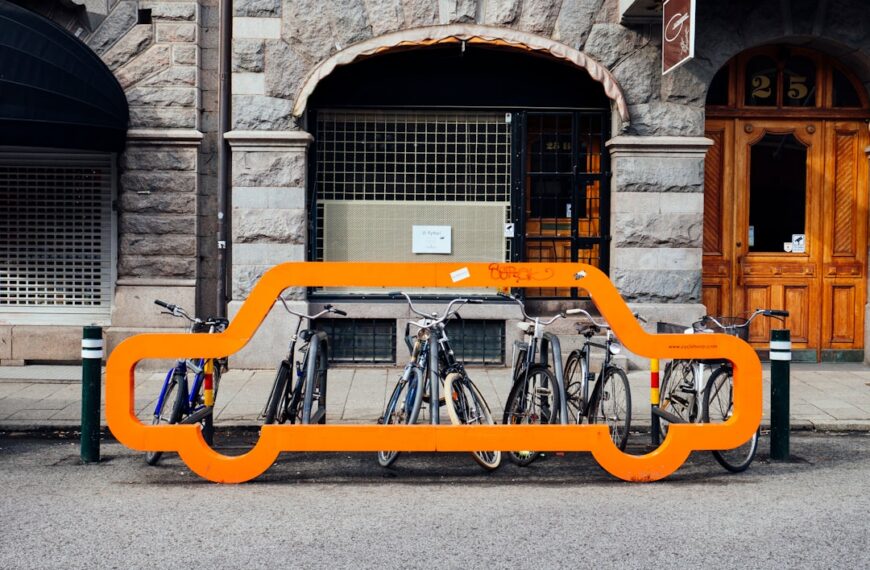 A bicycle parking, with a decoration shaped like a car, on a roadside in centeal Malmö, Sweden