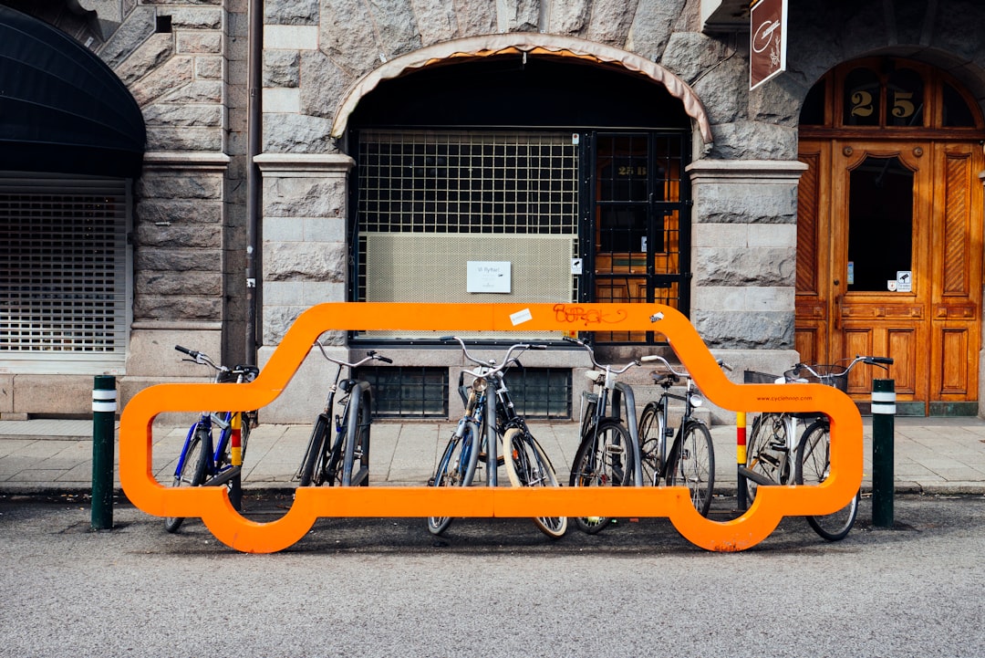 A bicycle parking, with a decoration shaped like a car, on a roadside in centeal Malmö, Sweden