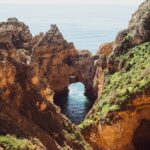 Steep cliffs by the sea – a broad view with many details in a rough landscape