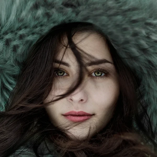 Woman face, she is wearing a big fur hat
