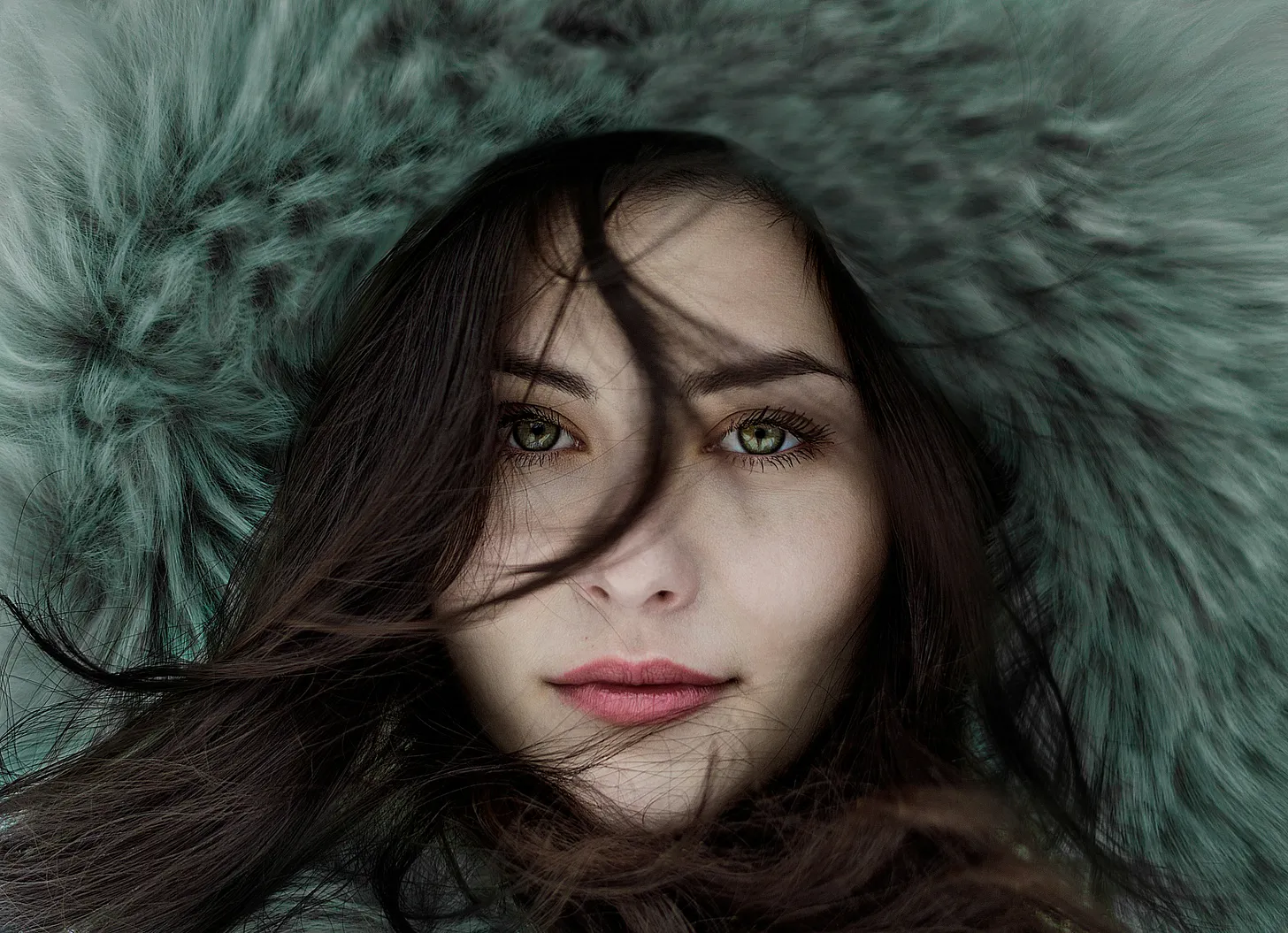 Woman face, she is wearing a big fur hat